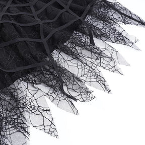 Detailed view of the uneven sheer lace points and thicker cutout web strips on the skirt.