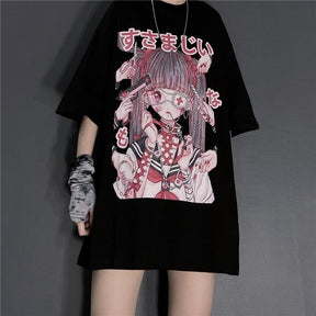 Front outfit view of the black oversized anime T-shirt with a long necklace and patterned wrist covering, showing the straight hem and roomy sleeves.