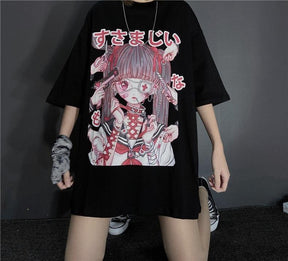 Black anime graphic T-shirt shown in a wide-legged standing pose, with the long hem covering the upper thighs and the pink-and-red artwork fully visible.