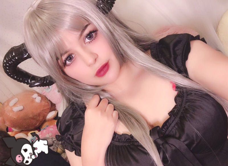 Demon horn headband shown worn with black curled horns visible beside the hair.