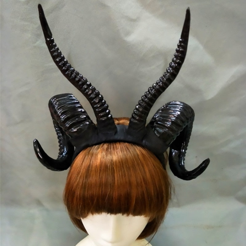 Demon horn headband in Plain Black, displayed on a wig mannequin.