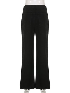 Back view of the black flare jeans on a clear mannequin, showing the plain rear legs, back pockets and wide frayed hems.