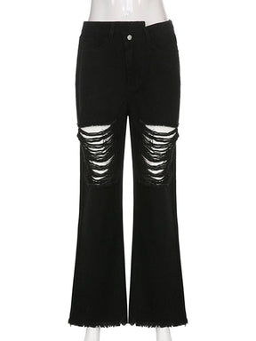 Black high-waisted flare jeans on a clear mannequin, showing laddered thigh and knee rips, flared lower legs and raw frayed hems.