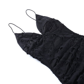 Black distressed mesh mini dress with the bodice laid flat.