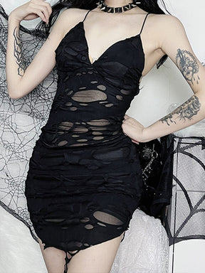 Black distressed mesh mini dress worn from the front with a hand at the hip.