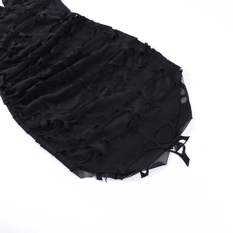 Black distressed mesh mini dress with a close view of the uneven hem.