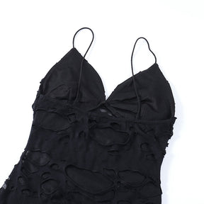 Black distressed mesh mini dress with the reverse bodice laid flat.