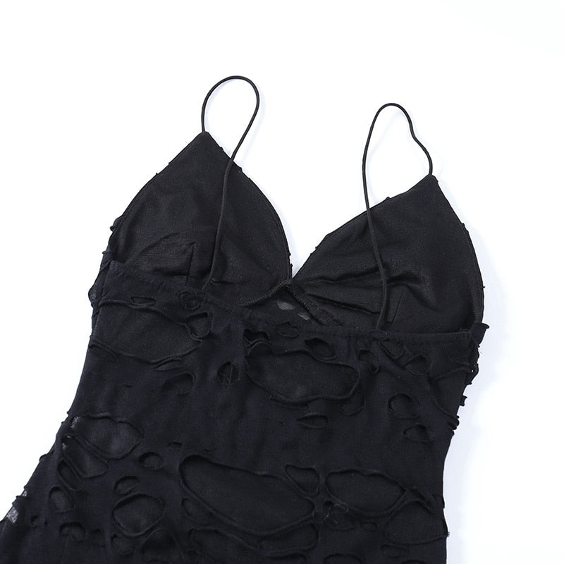 Black distressed mesh mini dress with the reverse bodice laid flat.