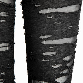 Close-up of black distressed pants showing frayed horizontal strips over fine, semi-sheer mesh and the texture around the torn edges.