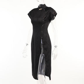 Angled product view of the black dragon-pattern cheongsam on a clear mannequin, showing the long skirt and open side below the buttons.