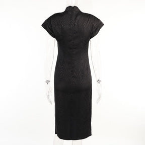 Back product view of a black cheongsam on a clear mannequin, with tonal dragon pattern, short sleeves and shaped seams through the waist.