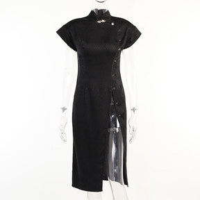 Black cheongsam on a clear mannequin, showing the fitted silhouette, short sleeves, stand collar and high opening along one side.