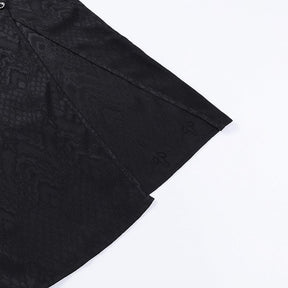 Close detail of the black cheongsam skirt fabric and stitched edges at the high side opening.