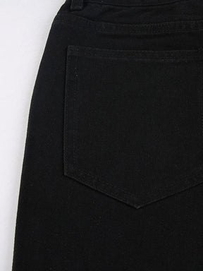 Close-up of a stitched rear patch pocket on the black high-waisted jeans.