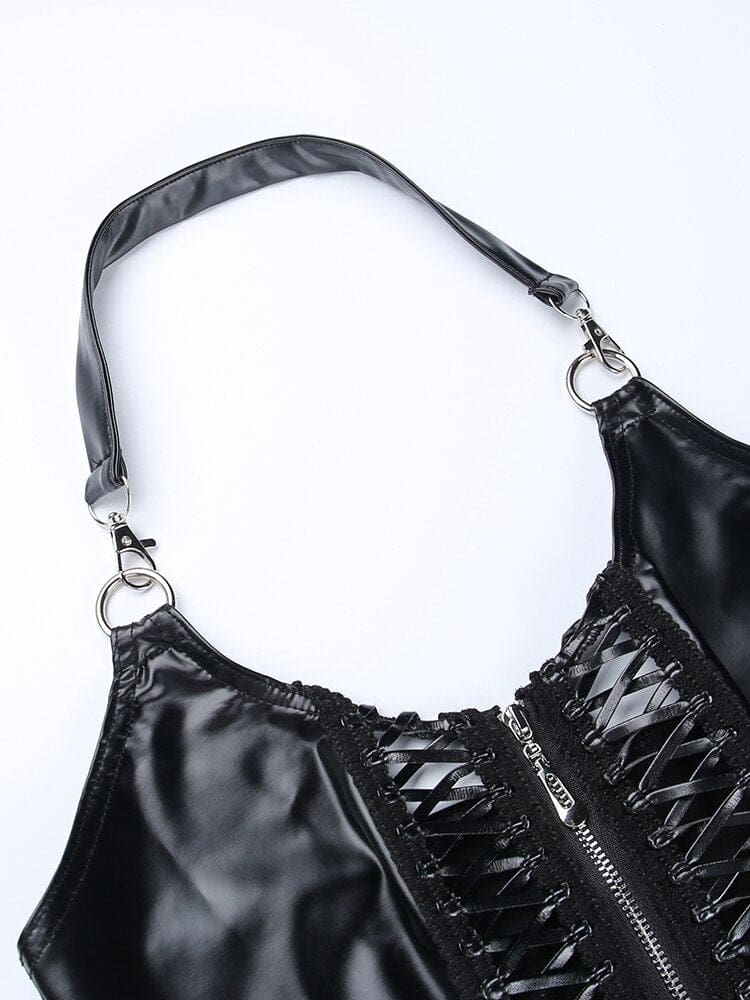 Flat close-up of the black halter strap clipped to two silver-tone rings, above the crop top’s curved neckline and zip-front laced panels.