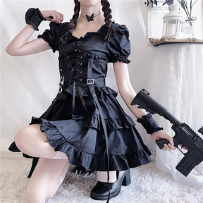 Additional copy of the seated gothic dress outfit, with the puff sleeves, corset buckles and long front ribbons visible.
