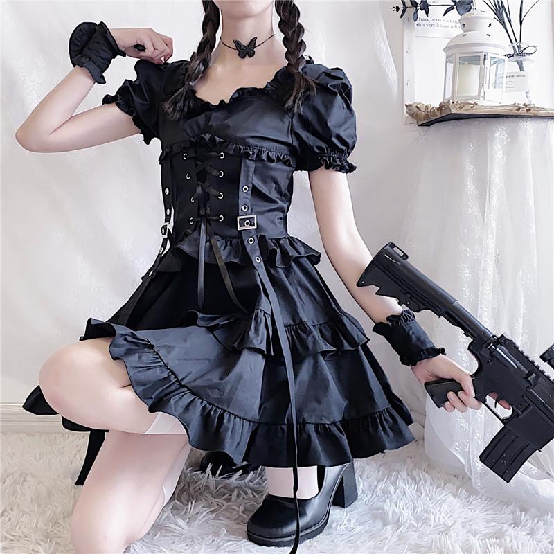 Additional copy of the seated gothic dress outfit, with the puff sleeves, corset buckles and long front ribbons visible.