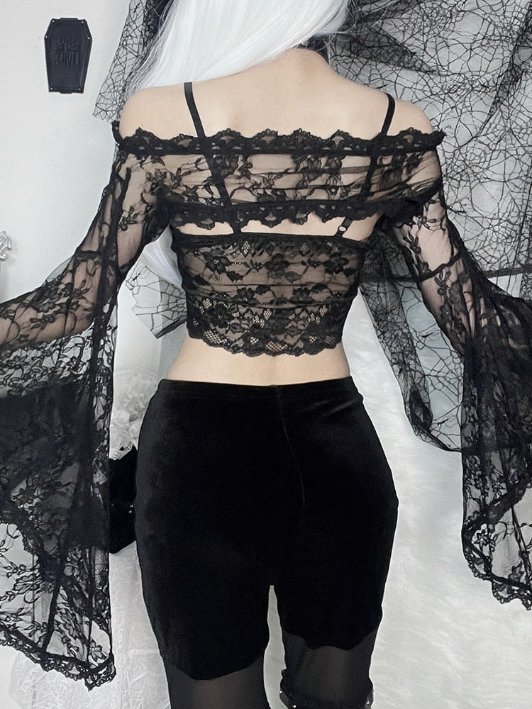 Back view of the sheer black lace overlay, showing the narrow shoulder band and flowing sleeves over a separate camisole.