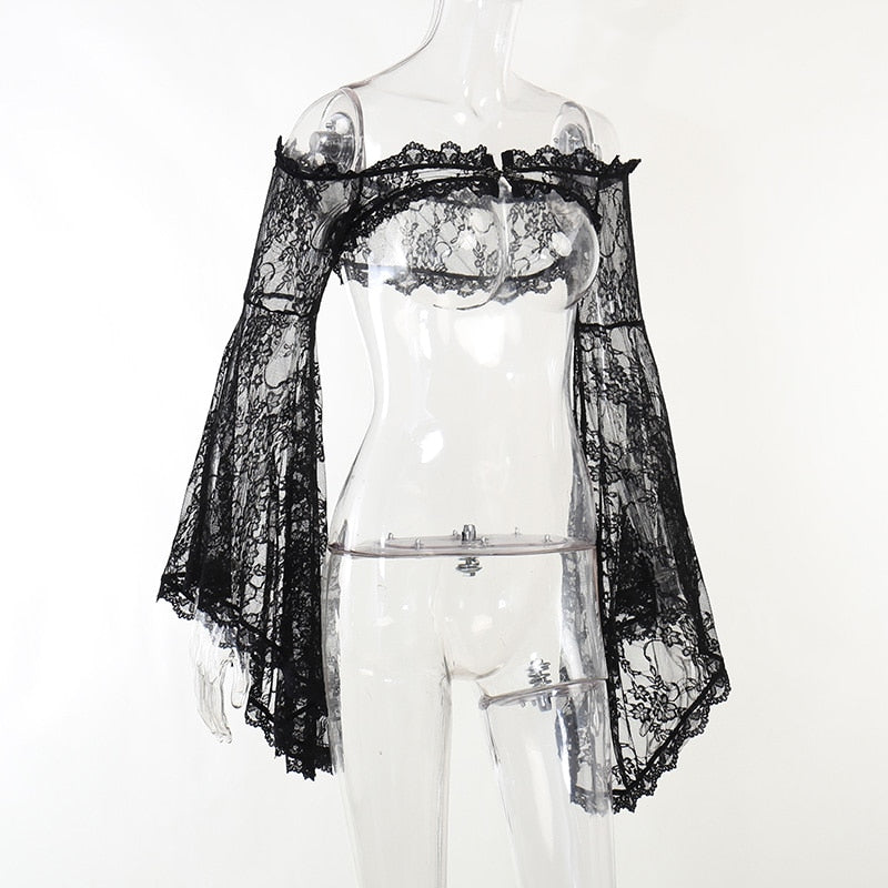 Angled mannequin view of the sheer lace shoulder overlay, highlighting the cropped body and ruffled trim.