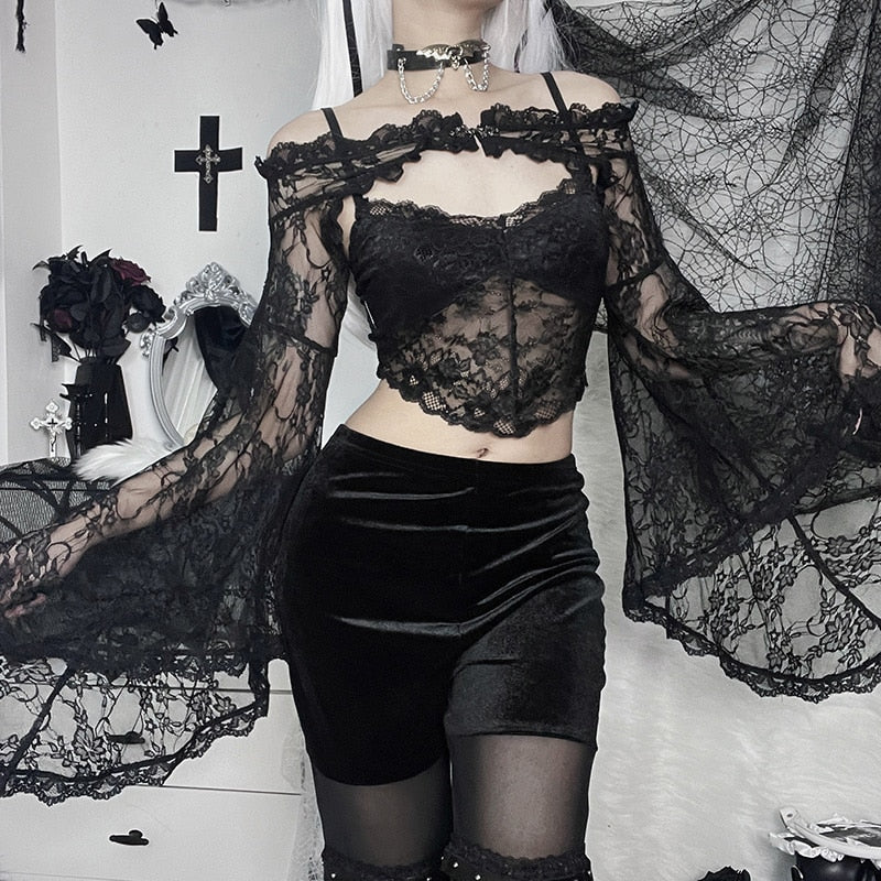 Front outfit view with the black lace overlay sleeves spread to either side, showing their long pointed outer edges.