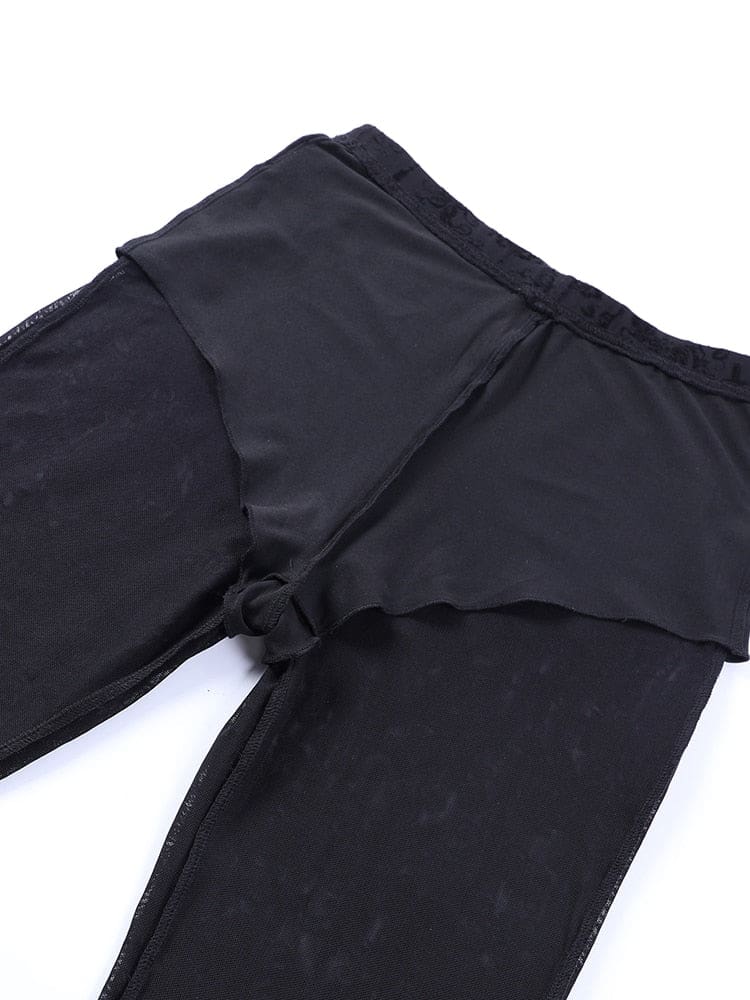 Inside view of the black bell bottom pants, showing the opaque brief-shaped lining attached within the sheer patterned outer layer.