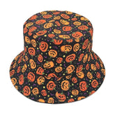 Black Halloween bucket hat viewed from above, covered in orange jack-o-lantern faces with small colorful stars and bats across the crown and brim.
