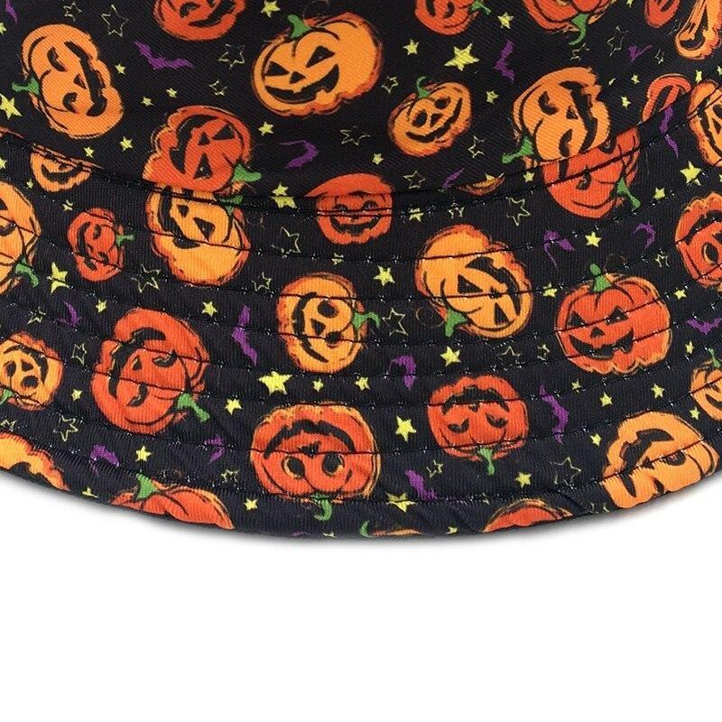 Close-up of the Halloween bucket hat's brim, showing stitched rows through orange jack-o-lanterns, yellow stars and small purple bat shapes.