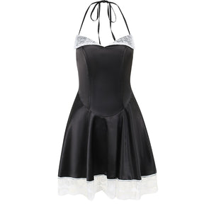 Black halter mini dress isolated on white, with tie-neck straps, white lace lapels and a flared lace-trimmed hem.