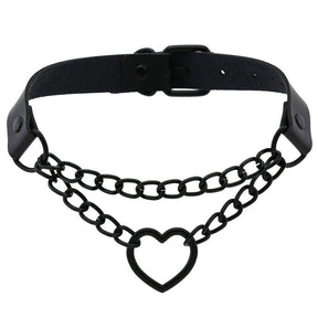 Black faux leather choker with a double-chain front and open heart pendant, arranged to show the band and buckle behind the chains.