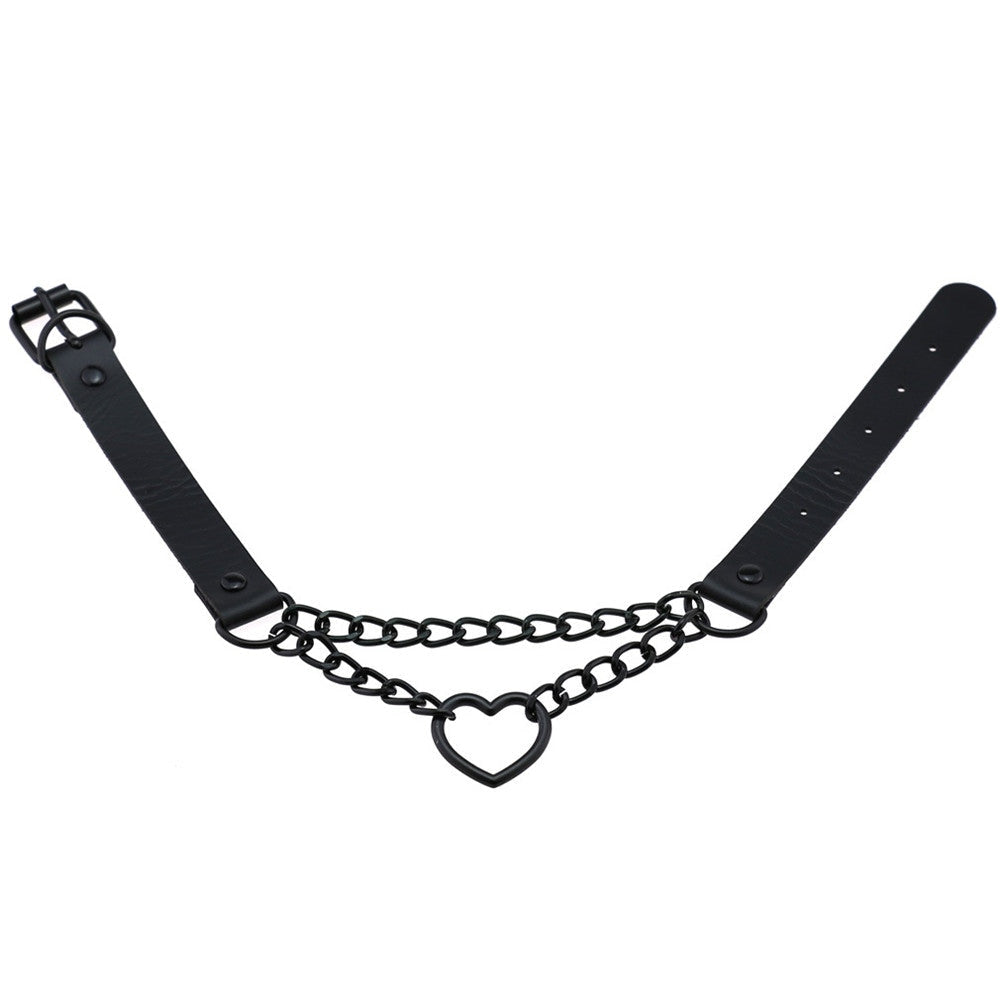 Black heart choker laid open on white, showing the buckle at one end, adjustment holes at the other and the two chain rows between them.