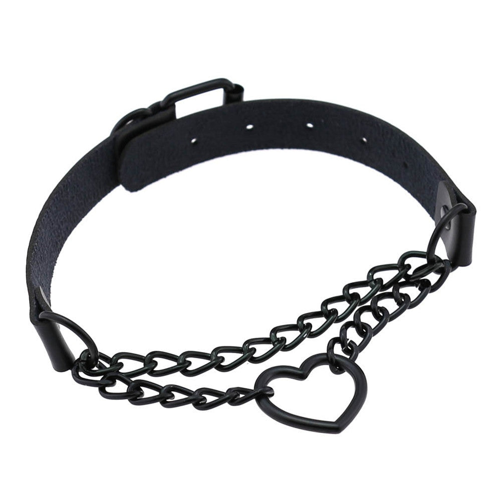 Angled view of the black heart chain choker with its perforated back band and buckle visible above the layered chain front.