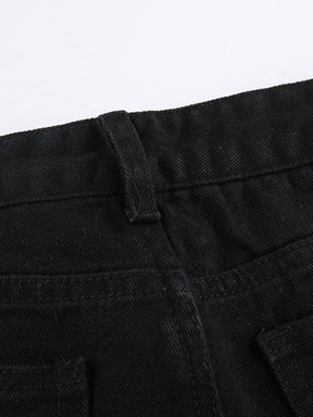 Detail of a belt loop and the stitched black denim waistband above a pocket edge.