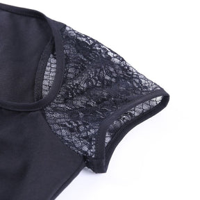 Flat close-up of a floral mesh cap sleeve, showing the sheer pattern and narrow black binding beside the opaque body.