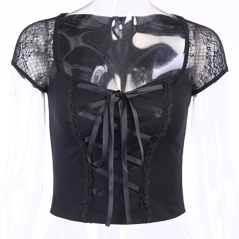 Black crop top on a clear mannequin, displaying its wide neckline, floral mesh cap sleeves and central ribbon lacing.