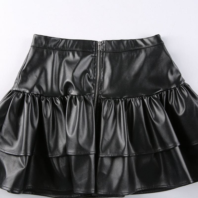 Back of the black ruffle mini skirt laid flat, showing the central zipper and the upper and lower tiers.