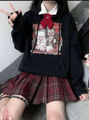 Black Menhera bear graphic hoodie styled with a separate white collar, red bow and plaid skirt.