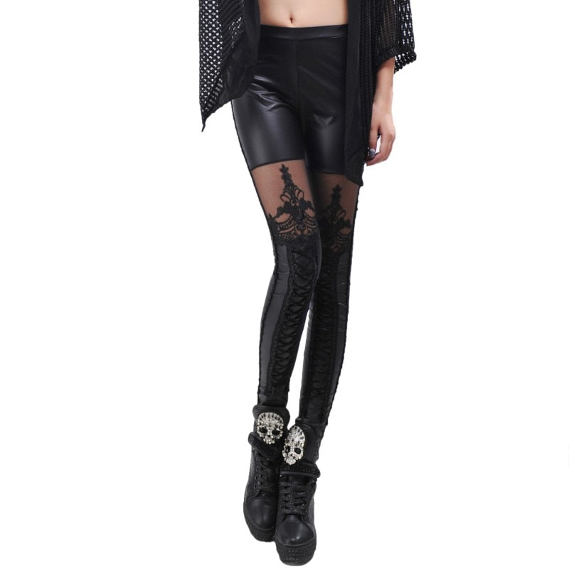 Black leather-look leggings with ornate mesh thigh panels and lower-leg lacing shown from the front in a full leg view.