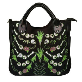 Front photograph of the black Monster Mash handbag with green hands, eyeballs, bones and pink brains visible below the curved handles.