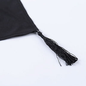 Black thread tassel attached to a pointed corner of the moon phase shawl.