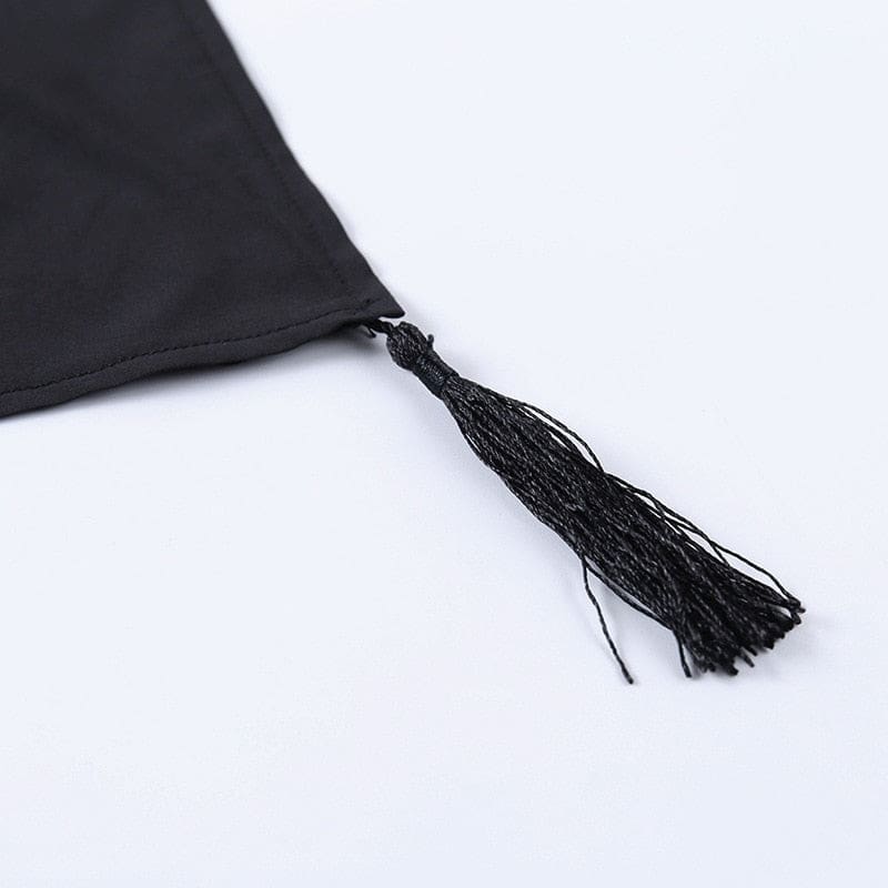 Black thread tassel attached to a pointed corner of the moon phase shawl.