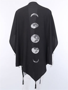 Back of the black celestial shawl on a mannequin, showing five pale moon phases.