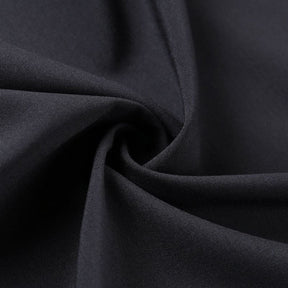 Close-up of the black wrap fabric gathered into soft folds.