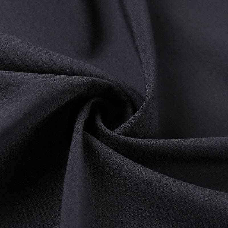 Close-up of the black wrap fabric gathered into soft folds.