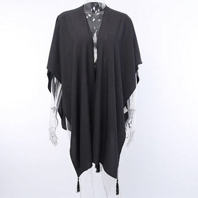 Front mannequin view of the black moon phase wrap with wide arm drapes and a plain front.