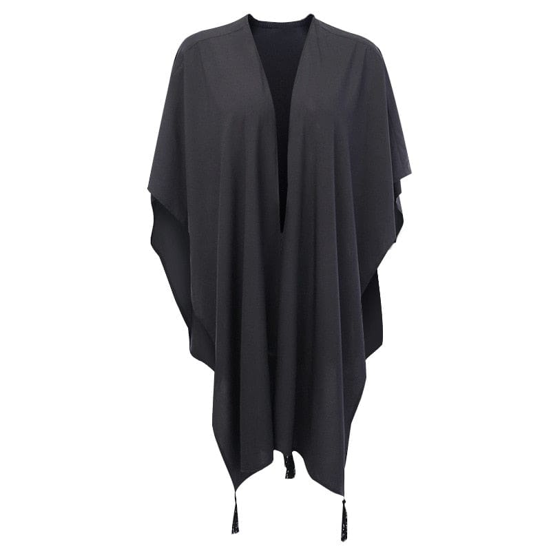 Plain open front of the black lunar shawl with draped sides and tassel trim.