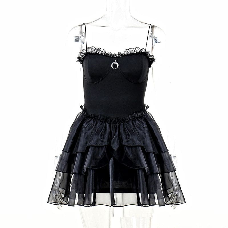 Black moon-charm mini dress on a mannequin, showing its thin straps and tiered ruffle skirt from the front.