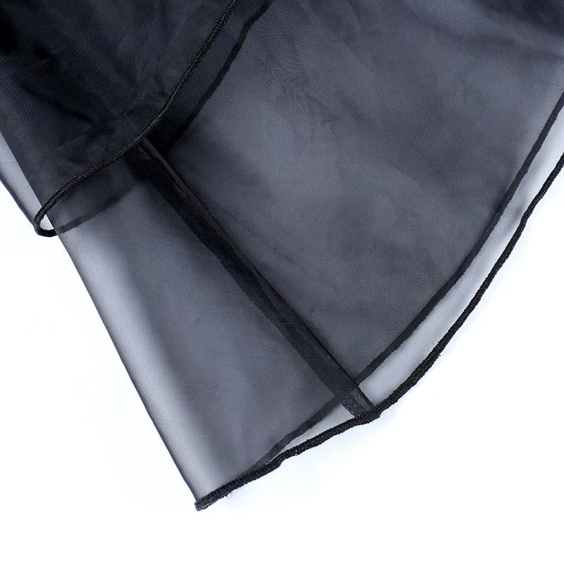 Close-up of the sheer black organza hem and its fine finished edge.