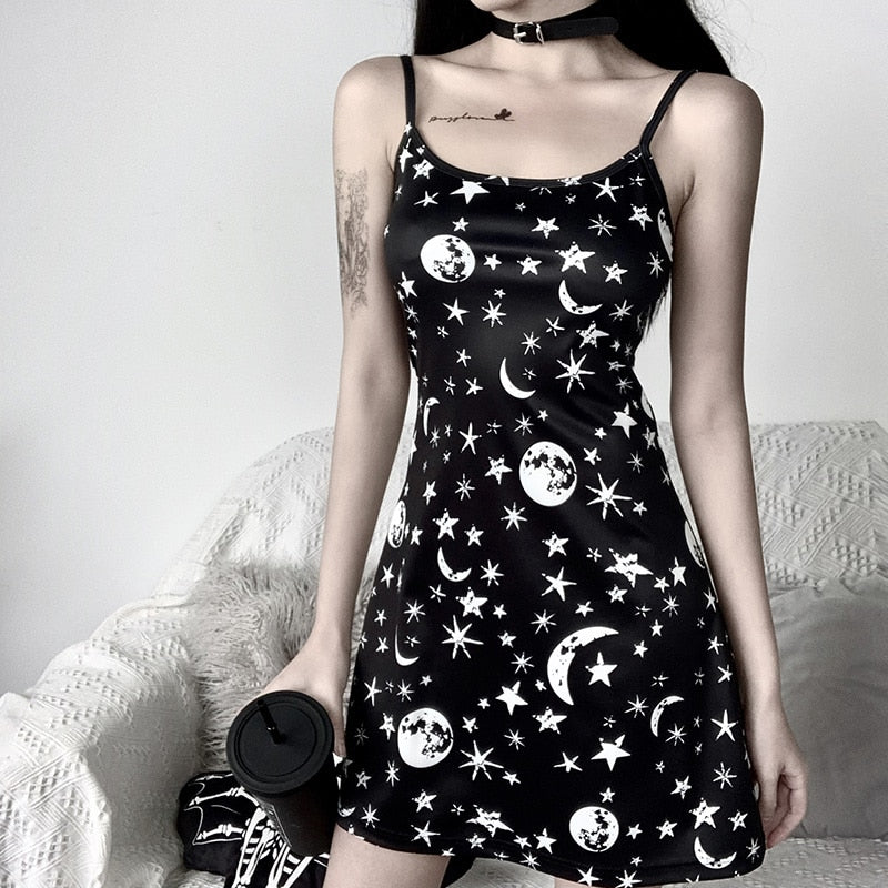 Black moon and star print mini dress shown in a straight-on front outfit view.