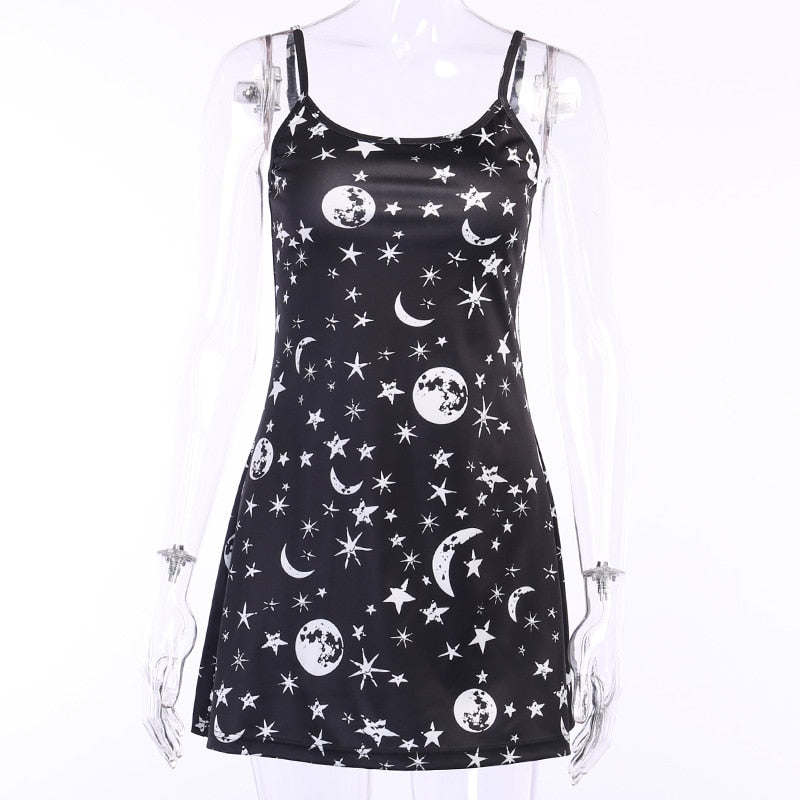 Black moon and star print mini dress displayed at a slight angle on a mannequin.