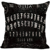 Black square Ouija pillow cover with decorative pale Gothic-style alphabet rows, fine curls and stars, and Yes, No and Good Bye lettering.